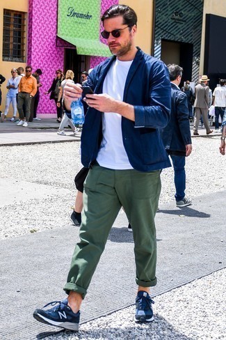 Navy Blazer Casual Outfits For Men: When the occasion calls for a casually sleek look, go for a navy blazer and dark green chinos. Navy athletic shoes will bring an easy-going feel to an otherwise traditional outfit.
