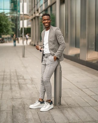 Grey Vertical Striped Blazer Outfits For Men: Dress in a grey vertical striped blazer and grey plaid chinos for a casual getup with a modernized spin. Does this look feel too perfect? Introduce white and black canvas low top sneakers to shake things up.