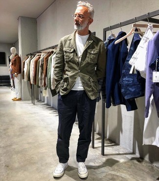 Olive Blazer Outfits For Men: This pairing of an olive blazer and navy chinos is the perfect balance between dressy and casual. To inject a hint of stylish nonchalance into this outfit, complete your outfit with white canvas high top sneakers.