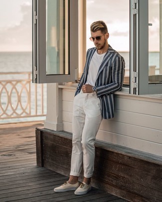 Navy Blazer Casual Outfits For Men: A navy blazer and white chinos are the perfect base for a ton of sharp outfits. Rounding off with beige canvas low top sneakers is an effective way to introduce an easy-going touch to your getup.