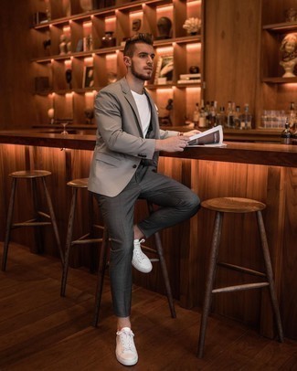 Grey Blazer Warm Weather Outfits For Men: Breathe a touch of casual elegance into your daily wardrobe with a grey blazer and charcoal chinos. Send an otherwise classic outfit in a more informal direction by wearing white leather low top sneakers.