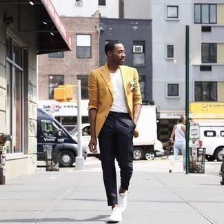 Yellow Blazer Outfits For Men: Team a yellow blazer with black chinos for a smart look. Introduce white canvas low top sneakers to the mix to easily up the cool of this look.