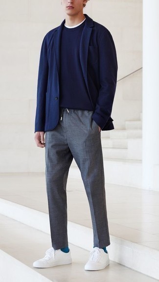 Charcoal Chinos Outfits: A navy blazer and charcoal chinos are the kind of effortlessly smart pieces that you can wear for years to come. White canvas low top sneakers are an effective way to upgrade this outfit.