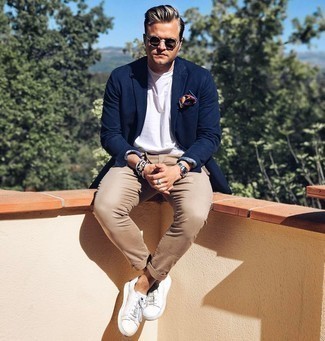 Brown Chinos Summer Outfits: A navy blazer and brown chinos are absolute mainstays if you're planning a refined wardrobe that holds to the highest menswear standards. White leather low top sneakers will add a sense of stylish effortlessness to an otherwise standard ensemble. Loving that this getup is perfect when real summer weather settles in.