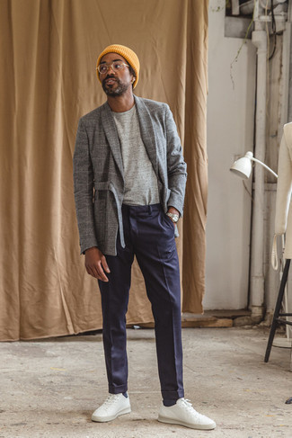 Charcoal Check Wool Blazer Outfits For Men: Make a charcoal check wool blazer and navy chinos your outfit choice for a sleek polished getup. Finishing with white leather low top sneakers is an easy way to inject a mellow vibe into your outfit.