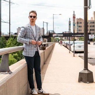 Navy Chinos Outfits: This pairing of a grey plaid blazer and navy chinos looks refined, but in a modern way. A pair of white and navy leather low top sneakers instantly boosts the appeal of your look.