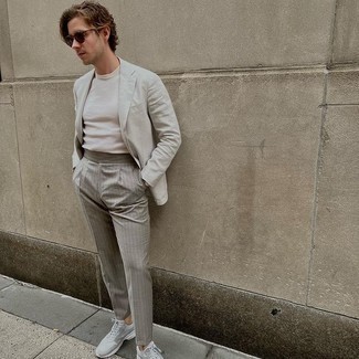 Grey Blazer Outfits For Men: Channel your inner fashionisto and try teaming a grey blazer with grey vertical striped chinos. Get a bit experimental on the shoe front and play down your outfit by finishing off with grey athletic shoes.