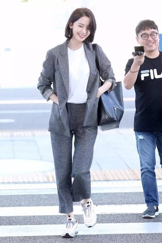 Grey Wool Blazer Outfits For Women: When it comes to high-octane glamour, this combination of a grey wool blazer and grey wool dress pants doesn't disappoint. Serve a little mix-and-match magic by finishing off with white athletic shoes.