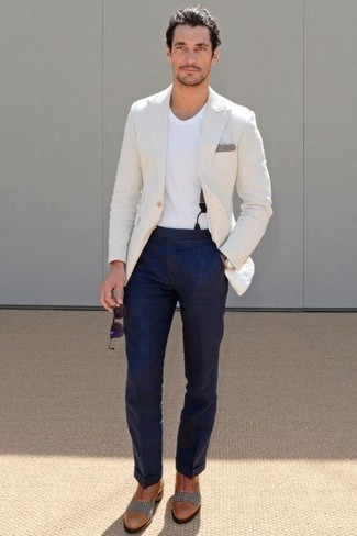 blue blazer and white trousers