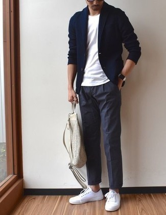 Navy Knit Blazer Outfits For Men: Go for a navy knit blazer and navy dress pants to have all eyes on you. Add white canvas low top sneakers to the mix to make the look more practical.
