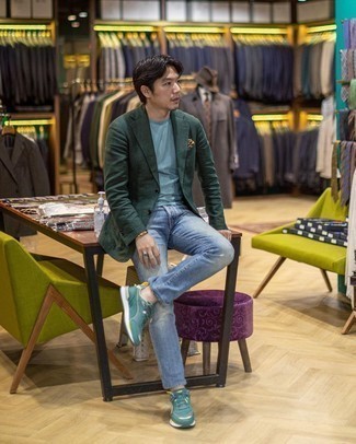 Dark Green Blazer Outfits For Men: If you're on the hunt for an off-duty yet on-trend outfit, opt for a dark green blazer and light blue ripped jeans. If you want to easily dress down this look with footwear, complete this outfit with a pair of dark green athletic shoes.