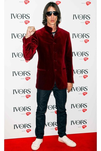 Channel your inner fashionisto and wear a burgundy velvet blazer and navy jeans. Put a modern spin on an otherwise sober look by rounding off with white leather low top sneakers.