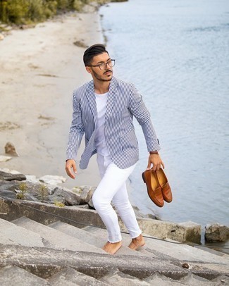 White and Black Vertical Striped Blazer Outfits For Men: Demonstrate your sartorial A-game in a white and black vertical striped blazer and white jeans. Round off with brown leather loafers to add a confident kick to the outfit.