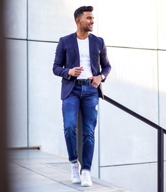 Purple Blazer Outfits For Men: If the setting permits an off-duty ensemble, you can dress in a purple blazer and navy ripped jeans. White leather low top sneakers are a stylish companion to this look.