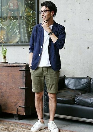 White and Green Leather Low Top Sneakers Outfits For Men: This combination of a navy cotton blazer and olive shorts looks seriously stylish, but it's also very easy to pull together. A pair of white and green leather low top sneakers instantly ramps up the street cred of this ensemble.