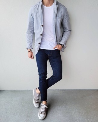 Grey Blazer Summer Outfits For Men: If it's comfort and practicality that you're seeking in menswear, rock a grey blazer with navy skinny jeans. A pair of grey canvas low top sneakers is a surefire footwear style that's also full of personality. It is actually possible to keep your cool under the scorching heat. The proof is right here