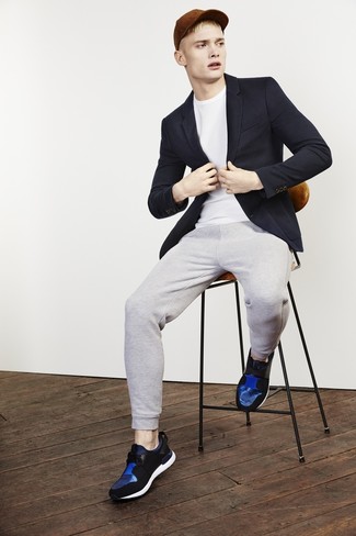 Navy and White Athletic Shoes Outfits For Men: A navy blazer and grey sweatpants have proven themselves as indispensable wardrobe heroes. Why not add navy and white athletic shoes to the mix for an element of stylish nonchalance?