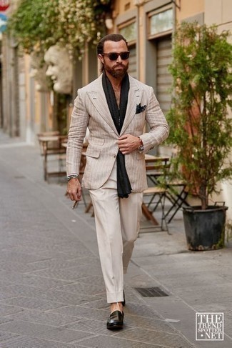 Beige Vertical Striped Blazer Outfits For Men: This is definitive proof that a beige vertical striped blazer and beige dress pants look awesome when paired together in an elegant getup for today's guy. Introduce a pair of dark green leather loafers to the mix and off you go looking incredible.