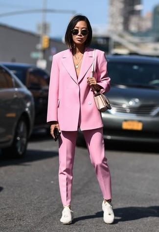 White Leather Low Top Sneakers Outfits For Women: For a polish-meets-cool look, try teaming a pink blazer with pink dress pants — these two items fit perfectly well together. Add a mellow feel to your ensemble by wearing a pair of white leather low top sneakers.