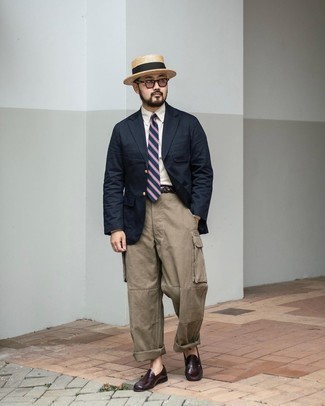 Hat Outfits For Men: For a city casual look without the need to sacrifice on practicality, we love this combination of a navy blazer and a hat. Finishing with burgundy leather loafers is a simple way to bring some extra flair to this look.