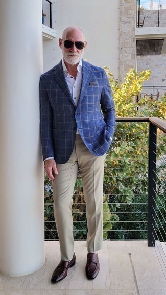 500+ Warm Weather Outfits For Men After 50: This smart combination of a navy plaid blazer and khaki chinos is super easy to put together in next to no time, helping you look on-trend and prepared for anything without spending too much time digging through your closet. You can take a more polished approach with shoes and introduce dark brown leather loafers to your outfit. All in all, an ideal demonstration of over-50 style.
