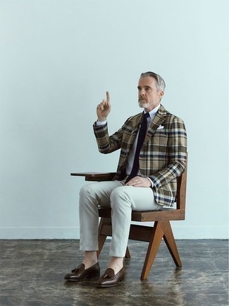 1200+ Outfits For Men After 50: One of the best ways for a man to style out such a practical piece as an olive plaid blazer is to team it with grey chinos. Complement this look with dark brown leather tassel loafers to avoid looking too casual. This look is probably what you're looking for as a gent in his 50s.