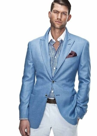 White and Blue Dress Shirt Outfits For Men: A white and blue dress shirt and white chinos are among the unshakeable foundations of any good menswear collection.