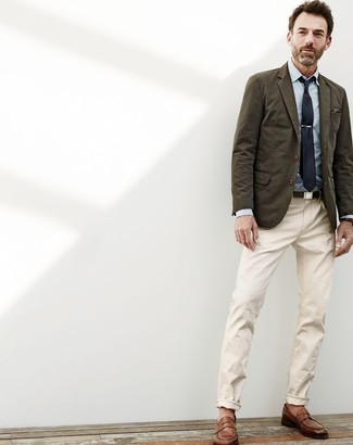 Olive Cotton Blazer Outfits For Men: This pairing of an olive cotton blazer and beige chinos is hard proof that a straightforward getup doesn't have to be boring. If you wish to immediately spruce up your outfit with one single piece, why not introduce brown leather loafers to your look?