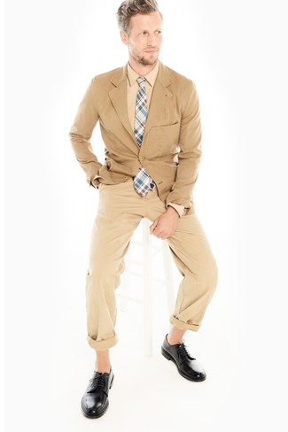Tan Cotton Blazer Outfits For Men: This combination of a tan cotton blazer and khaki chinos is a surefire option when you need to look casually neat but have no time. And if you want to easily kick up your ensemble with a pair of shoes, complete this getup with black leather derby shoes.