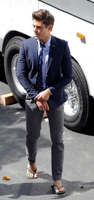 Zac Efron wearing Navy Check Blazer, White and Blue Vertical Striped Dress Shirt, Charcoal Chinos, Charcoal Rubber Sandals