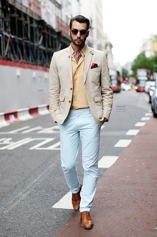 Yellow Dress Shirt Outfits For Men: A smart casual combo of a yellow dress shirt and light blue chinos can keep its relevance in a great deal of occasions. Make a bit more effort now and complement this outfit with a pair of tobacco leather brogues.