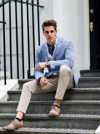 Tan Leather Derby Shoes Outfits: This combination of a light blue blazer and khaki chinos makes for the perfect base for a myriad of looks. Why not complete this ensemble with a pair of tan leather derby shoes for an added touch of elegance?
