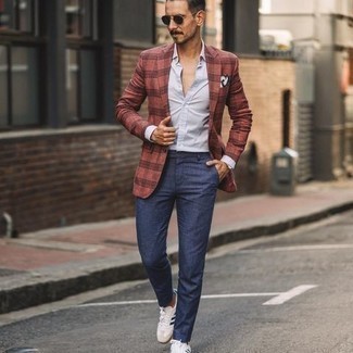 Red and Navy Plaid Blazer Outfits For Men: Go for a straightforward but polished option marrying a red and navy plaid blazer and navy chinos. If you want to effortlessly play down this look with one single item, complement this outfit with a pair of white and navy canvas low top sneakers.