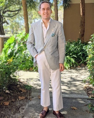Grey Vertical Striped Seersucker Blazer Outfits For Men: This ensemble shows that it pays to invest in such menswear staples as a grey vertical striped seersucker blazer and white chinos. If you want to immediately perk up this ensemble with a pair of shoes, complete this ensemble with burgundy leather tassel loafers.