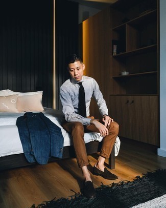 White and Black Vertical Striped Dress Shirt Outfits For Men: This pairing of a white and black vertical striped dress shirt and brown chinos looks sharp, but it's super easy to throw together. Dark brown suede tassel loafers will bring a bit of elegance to an otherwise everyday outfit.