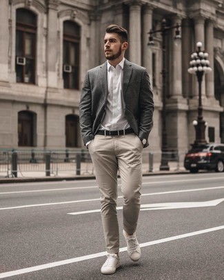 Charcoal Vertical Striped Blazer Outfits For Men: This combination of a charcoal vertical striped blazer and beige chinos is an interesting balance between classy and laid-back. You can get a little creative when it comes to footwear and play down your getup by slipping into a pair of white canvas low top sneakers.