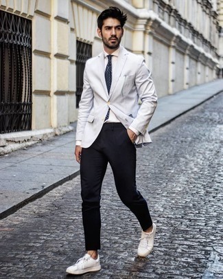 Navy and White Print Tie Outfits For Men: A grey blazer and a navy and white print tie are absolute wardrobe heroes if you're putting together a dapper wardrobe that holds to the highest men's style standards. Does this outfit feel all-too-perfect? Introduce a pair of white leather low top sneakers to switch things up.