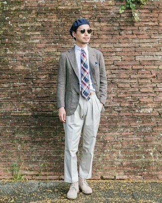 Grey Blazer Spring Outfits For Men: Channel your inner fashionisto and consider teaming a grey blazer with grey chinos. Beige suede desert boots look awesome completing your look. With spring coming, it's time to put on simple and dapper looks, just like this one.