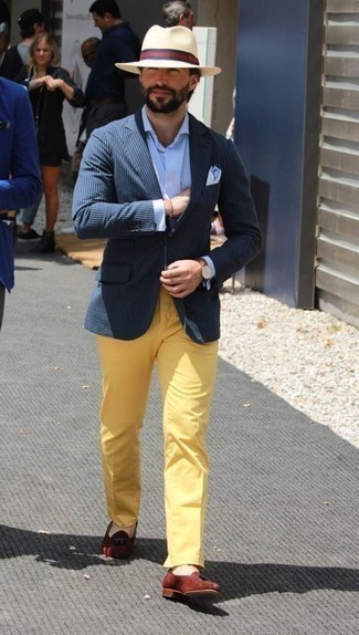 Navy and White Vertical Striped Blazer Outfits For Men: As you can see, looking effortlessly elegant doesn't require that much effort. Just reach for a navy and white vertical striped blazer and yellow chinos and you'll look incredibly stylish. Tobacco suede tassel loafers will breathe a dose of refinement into an otherwise straightforward ensemble.