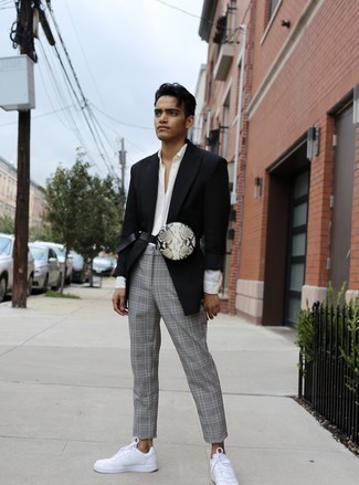 Black Blazer Outfits For Men: For an ensemble that's effortlessly classic and envy-worthy, wear a black blazer and grey plaid chinos. A pair of white leather low top sneakers brings a laid-back aesthetic to the look.