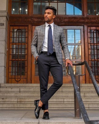 Grey Blazer Smart Casual Outfits For Men: A grey blazer and black chinos are the kind of a never-failing outfit that you need when you have zero time. Switch up this ensemble with a smarter kind of shoes, like this pair of black leather loafers.
