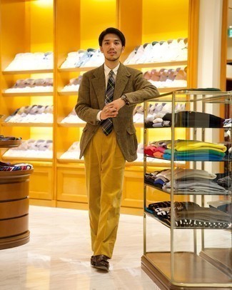 Yellow Corduroy Dress Pants Outfits For Men: Solid proof that an olive herringbone wool blazer and yellow corduroy dress pants look amazing when you team them up in a sophisticated look for a modern gentleman. If not sure as to what to wear in the footwear department, go with a pair of dark brown leather tassel loafers.