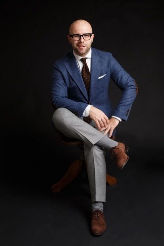 500+ Dressy Outfits For Men: A navy wool blazer and grey dress pants are worth adding to your list of bona fide menswear staples. Brown suede oxford shoes act as the glue that will bring this look together.