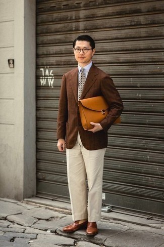 500+ Dressy Outfits For Men: A brown vertical striped blazer and white dress pants? Make no mistake, this outfit will make heads turn. Complement this ensemble with brown leather loafers for maximum effect.
