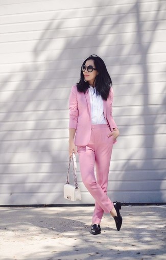 Hot Pink Blazer Outfits For Women: Wear a hot pink blazer and pink dress pants and you'll put together a sleek and polished outfit. You can get a bit experimental in the footwear department and add a pair of black leather low top sneakers to this getup.