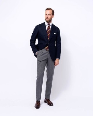 Red and Navy Horizontal Striped Tie Outfits For Men: Choose a navy blazer and a red and navy horizontal striped tie to have all eyes on you. When in doubt about what to wear in the shoe department, go with dark brown leather derby shoes.