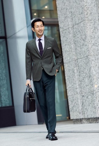 Black Canvas Briefcase Outfits: This pairing of a charcoal blazer and a black canvas briefcase looks awesome and makes any gentleman look infinitely cooler. If you need to immediately ramp up your outfit with one piece, complement this look with black leather derby shoes.
