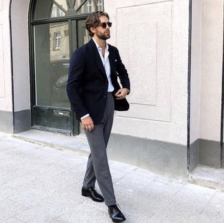 Navy Blazer Dressy Outfits For Men: Indisputable proof that a navy blazer and grey dress pants are awesome when paired together in a refined look for a modern dandy. If in doubt as to the footwear, stick to black leather oxford shoes.