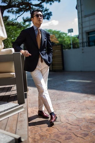 Tan Polka Dot Tie Outfits For Men: Rock a navy blazer with a tan polka dot tie if you're aiming for a proper, dapper outfit. Complement this outfit with burgundy leather loafers et voila, your getup is complete.