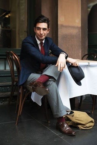 Burgundy Tie Outfits For Men: For a look that's nothing less than wow-worthy, wear a navy blazer with a burgundy tie. Introduce an air of stylish nonchalance to by finishing off with brown leather double monks.